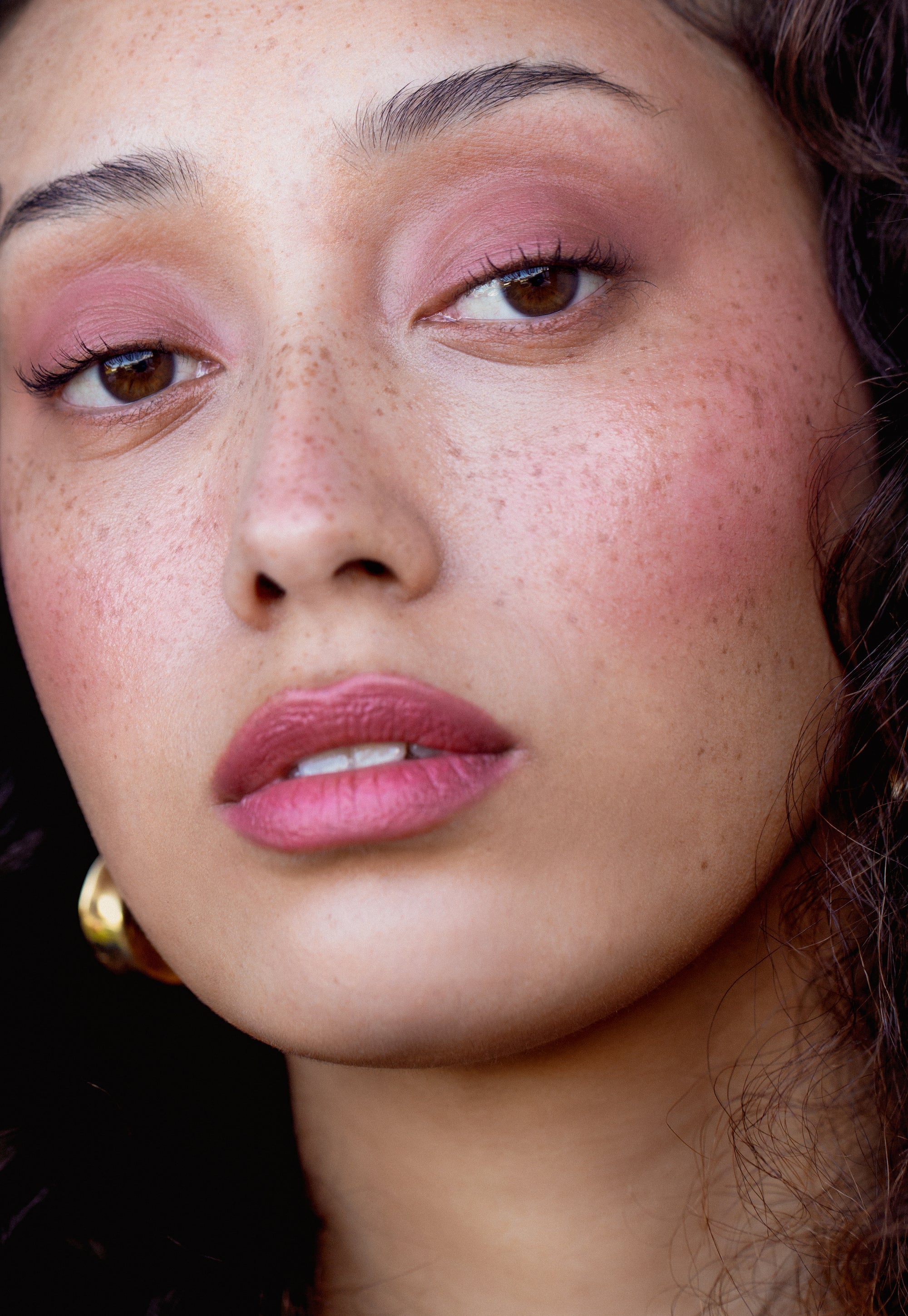 Model wearing Aleph Cheek and Lip tint on their cheeks, lips and eyes