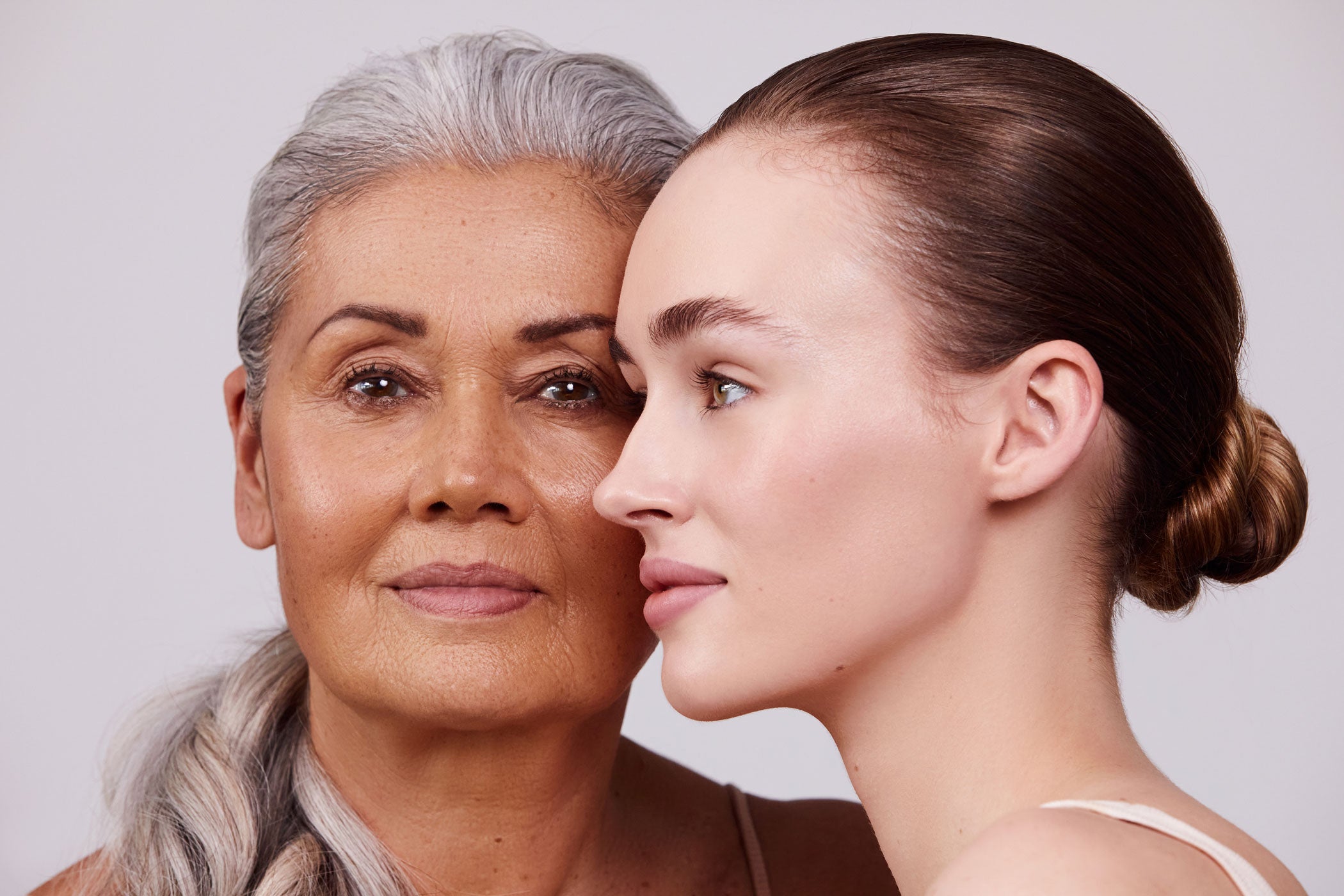 Face shots of two models wearing Aleph Beauty Make-up