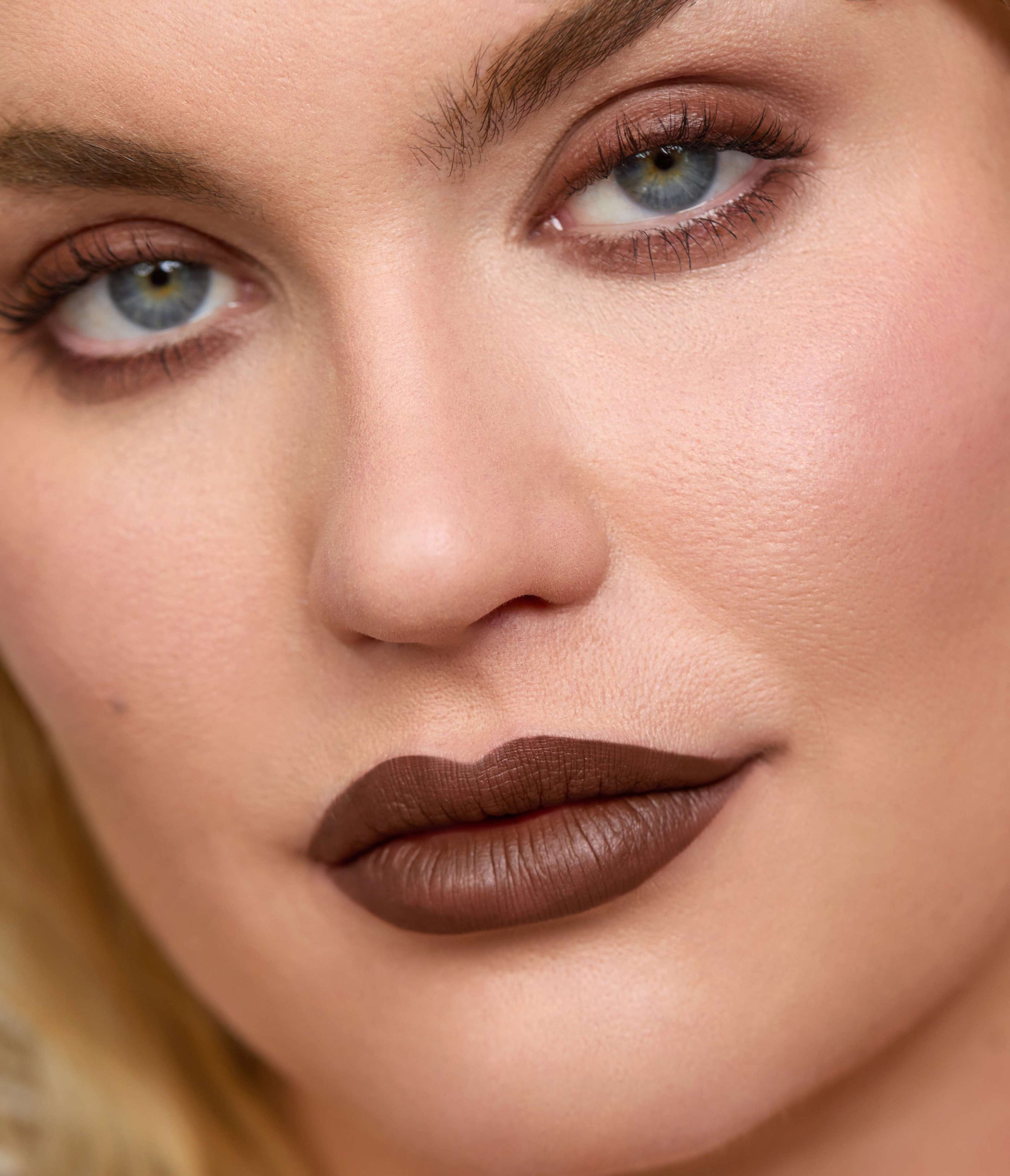 Close-up of a Model face wearing Aleph Eye/Lip Multi Liner Umber