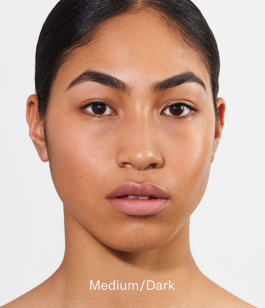 Model wearing Smoothing Skin Tint / SPF20 in shade Medium/Dark