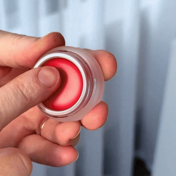 GIF of Aleph Beauty Cheek/Lip Tint and Mixing Balm Treatment being mixed on the back of the arm 