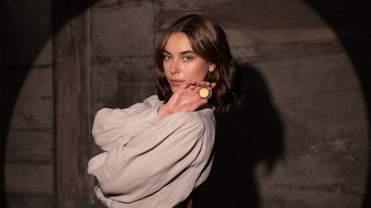 Image of woman holding Aleph Beauty Mixing/Balm Treatment